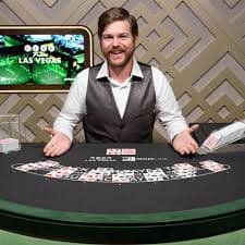 Live Sic Bo game table with dealer, three dice, and betting interface on betberry slot